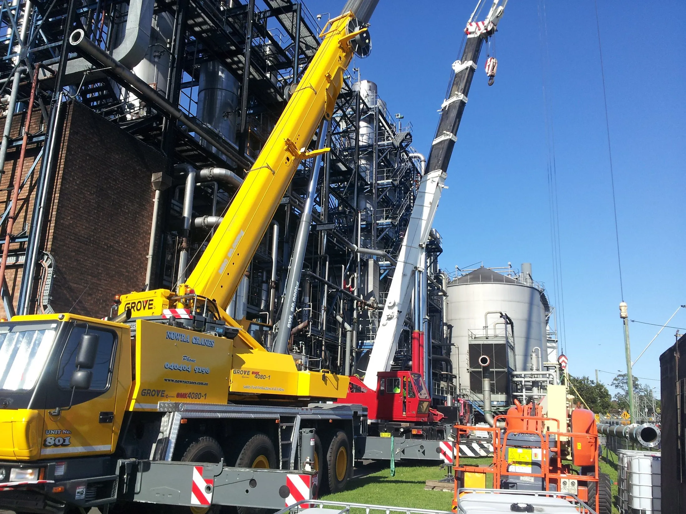 All-terrain crane lifting at an industrial plant
