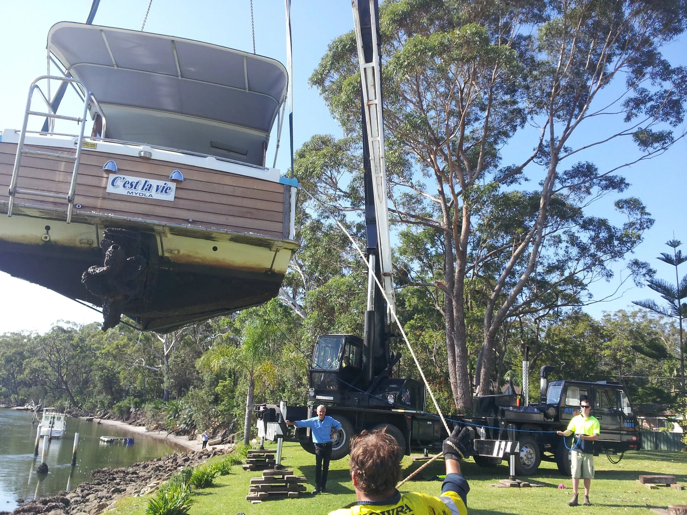 Boat lifted over a river bank