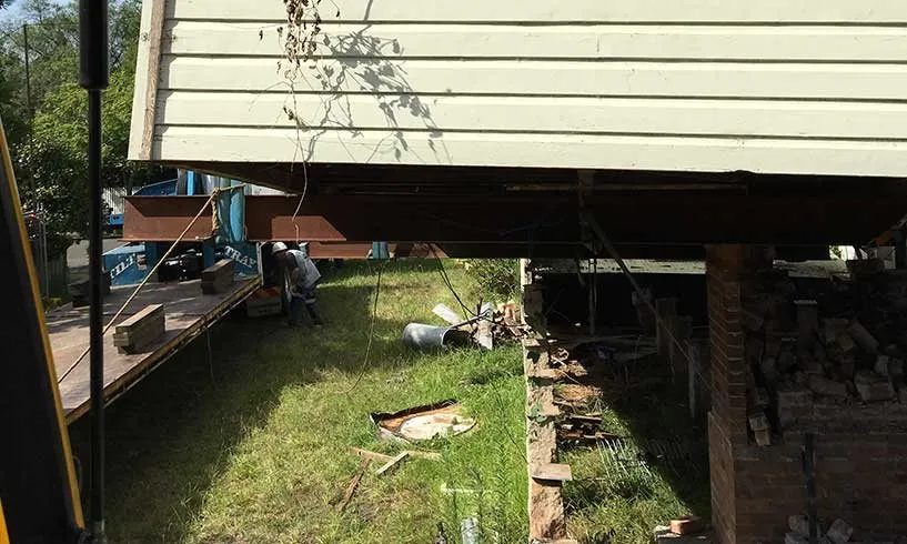 Underside of a house as it is lifted