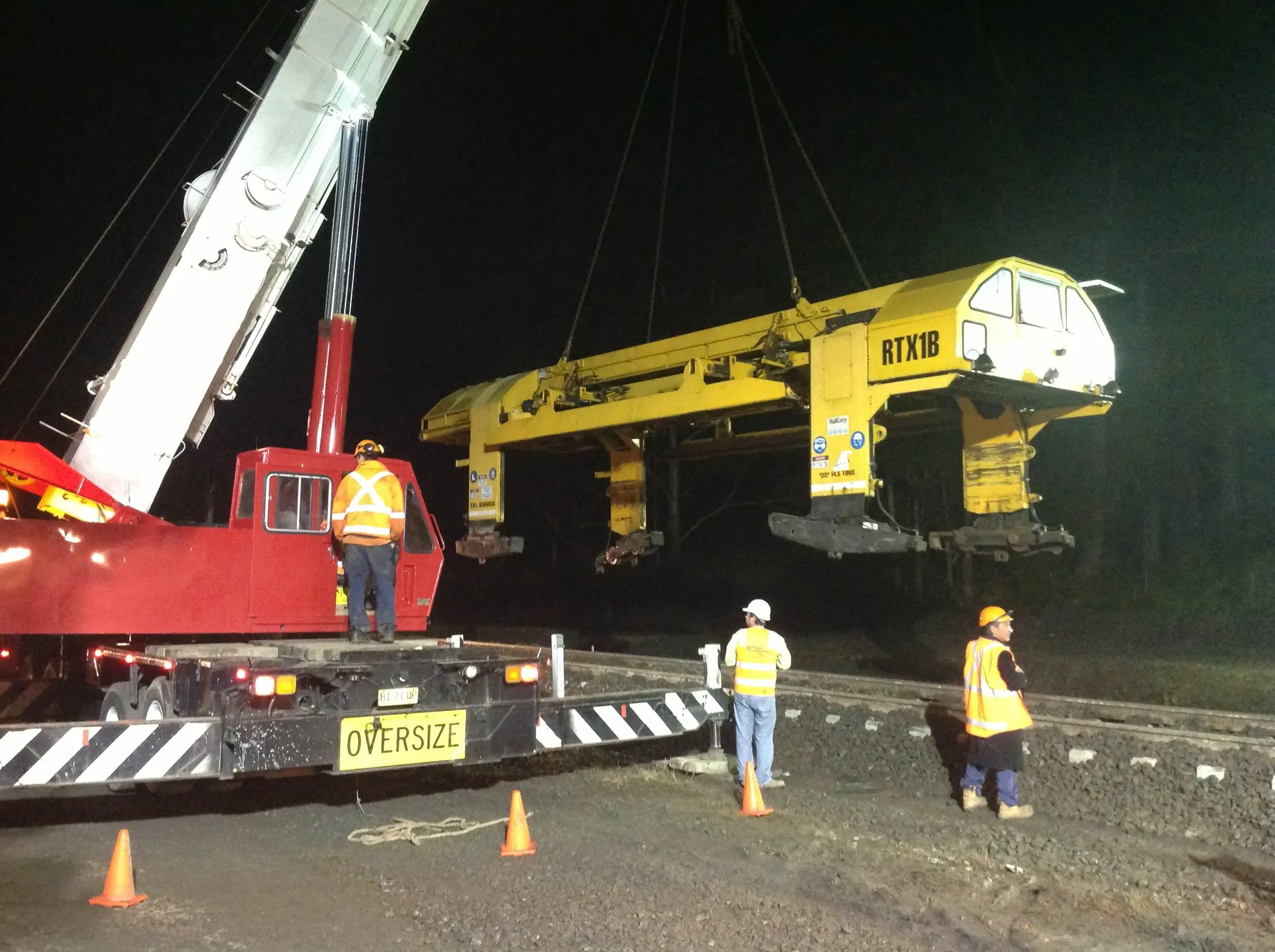 Oversize machine lifted at night