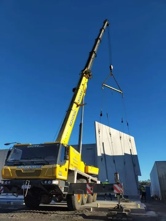 All-terrain crane lifting a precast panel