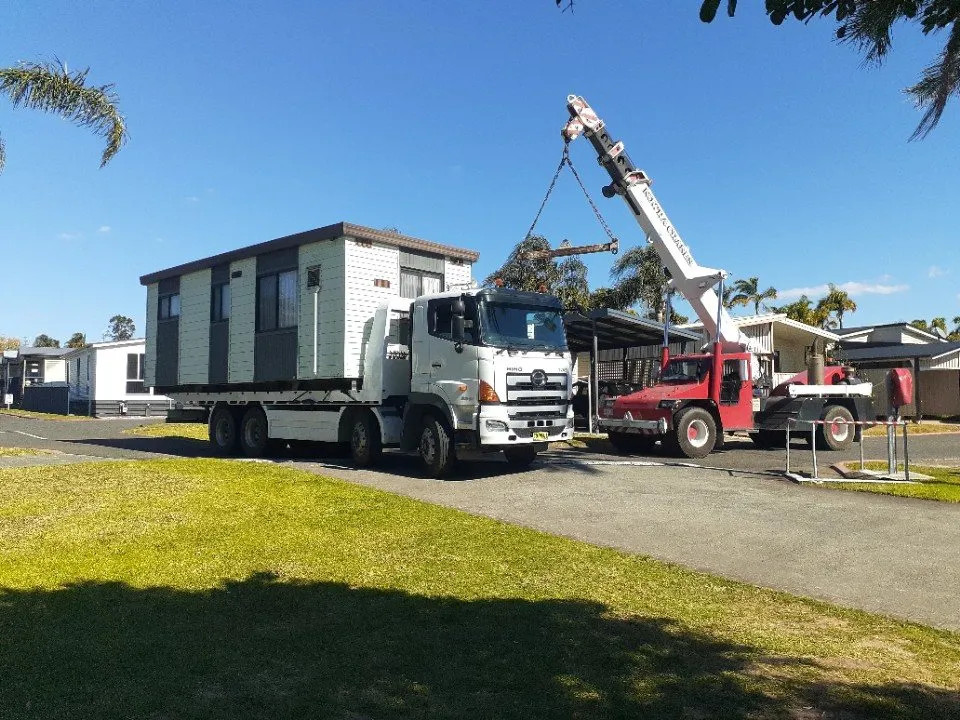 A transportable building lifted off a truck by one of our cranes
