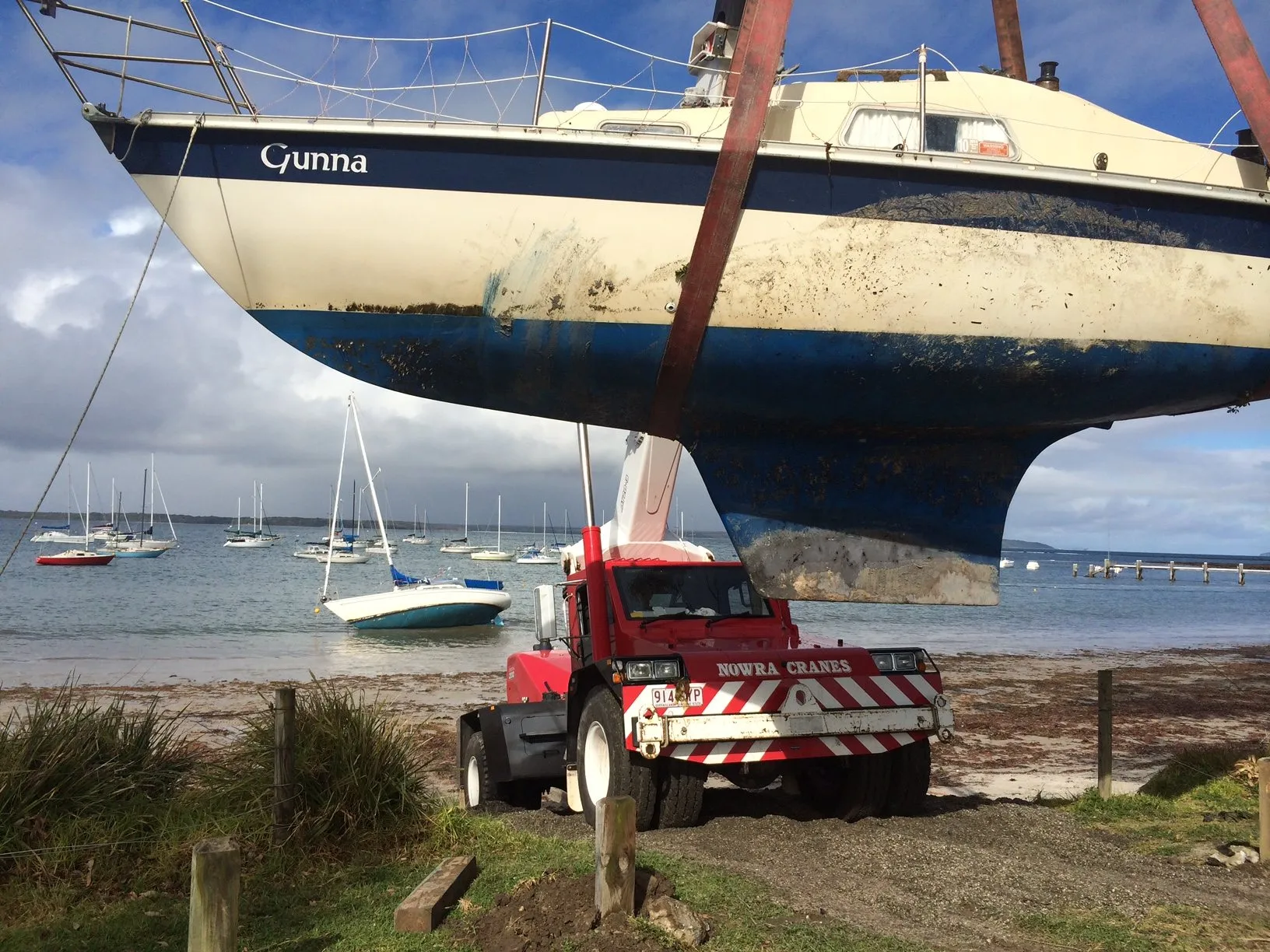 Yacht lifted clear of the beach at low tide